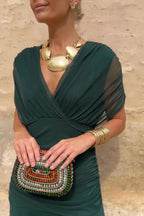 Women wearing the Harrow Amira floral maxi dress with off-shoulder design, perfect for cocktail parties and elegant occasions.