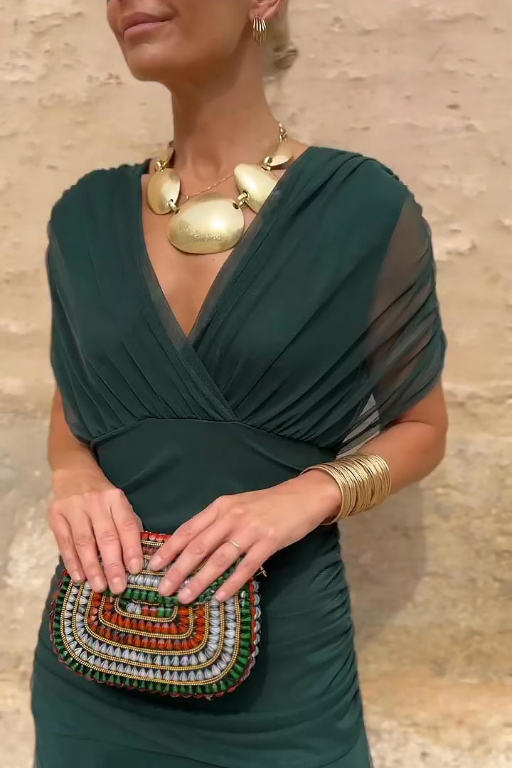 Women wearing the Harrow Amira floral maxi dress with off-shoulder design, perfect for cocktail parties and elegant occasions.