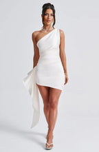 Women wearing the Harrow Angie sleek ruched one-shoulder mini dress, perfect for cocktail parties, showing its fitted silhouette and elegant design.