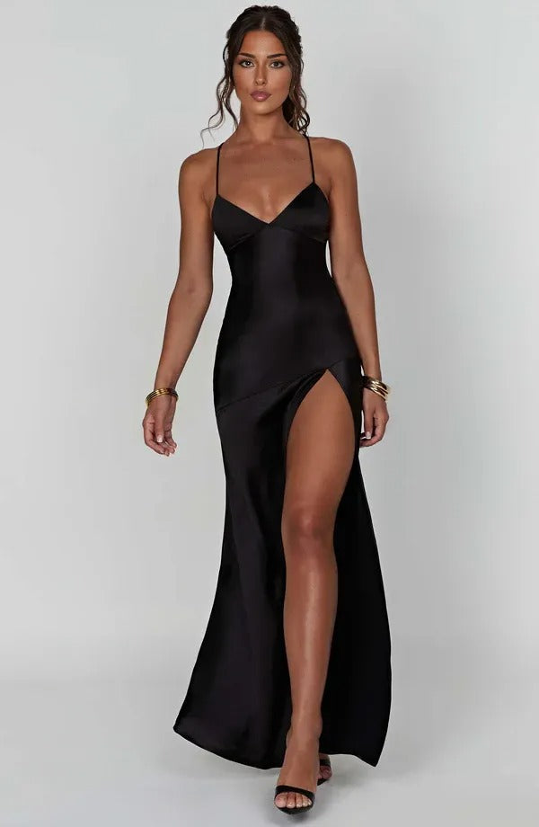 Women wearing Harrow Annika luxe satin maxi dress with V-neck and side slit, perfect for cocktail parties.