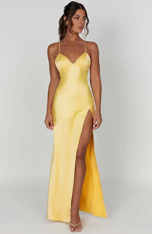 Women wearing the Harrow Annika satin maxi dress with V-neckline and thigh-high slit, styled for a cocktail party.