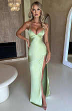 Women wearing the Harrow Annika luxe satin maxi dress with a V-neckline and thigh-high slit, suited for cocktail parties.