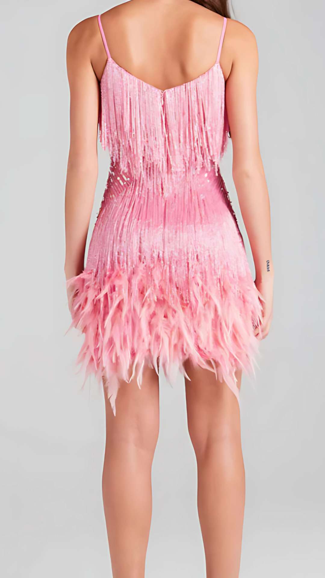 Women wearing the Harrow Antoinette sequin mini dress with fringe and V-neck, perfect for glamorous cocktail parties.