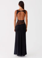 Women wearing the Harrow Ariel elegant lace maxi dress with sleeveless design and cutout details, perfect for cocktail parties.