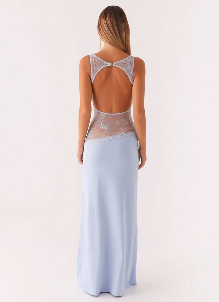 Women wearing Harrow Ariel lace maxi dress with cutout details, sleeveless design, perfect for cocktail parties.