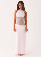 Women wearing a sleeveless lace cutout maxi dress by Harrow, elegant style perfect for cocktail parties.
