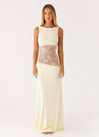 Women wearing a sleeveless lace maxi dress with cutout details, elegant style for cocktail parties by Harrow Ariel.