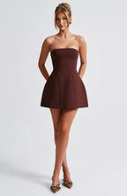 Women’s playful ruffle mini dress by Harrow, strapless bubble style perfect for cocktail parties, shown on a model.