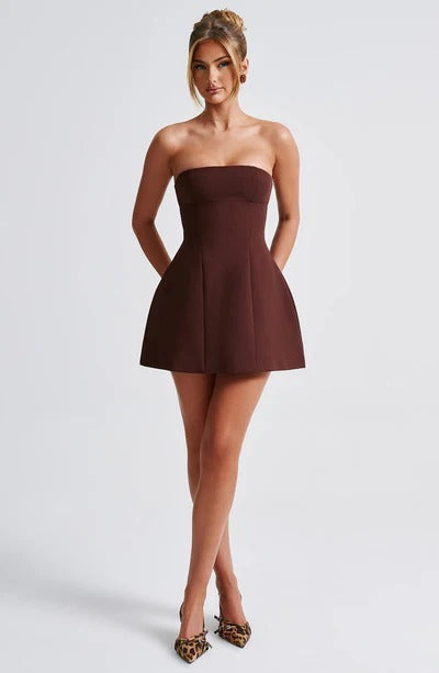 Women’s playful ruffle mini dress by Harrow, strapless bubble style perfect for cocktail parties, shown on a model.
