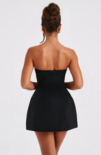 Women wearing the Harrow Athena playful ruffle mini dress, strapless cocktail dress with bubble skirt detail.