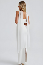 Women wearing the Audra Harrow sleek ruched bodycon maxi dress with a strapless neckline and matching scarf for cocktail parties.