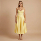 Women wearing the Harrow Beatrice romantic sweetheart midi dress with a fit and flare silhouette, ideal for cocktail parties.