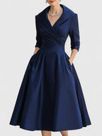 Harrow Beatrix glamorous cocktail midi dress with V-neck, 3/4 sleeves, and pockets, perfect for elegant cocktail parties.