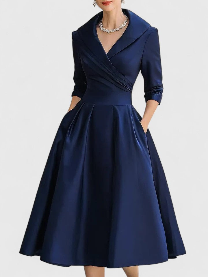 Harrow Beatrix glamorous cocktail midi dress with V-neck, 3/4 sleeves, and pockets, perfect for elegant cocktail parties.