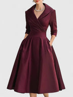 Harrow Beatrix cocktail midi dress for women with V-neck, 3/4 sleeves, glamorous style, and practical pockets.