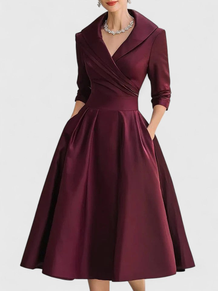 Harrow Beatrix cocktail midi dress for women with V-neck, 3/4 sleeves, glamorous style, and practical pockets.