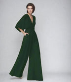 Women wearing Harrow Blair V-neck flutter sleeve wide-leg jumpsuit, showcasing a stylish, effortless evening look.