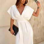 Women wearing Harrow Bonnie wide leg V-neck jumpsuit with flutter sleeves, showcasing elegant style and relaxed fit.