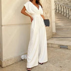 Women wearing Harrow Bonnie wide-leg V-neck jumpsuit with flutter sleeves, stylish for cocktails and elegant occasions.