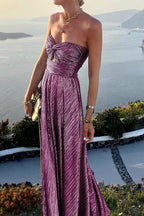 Women wearing the Harrow Britta glamorous sequin maxi dress with a strapless, pleated metallic design for formal events.