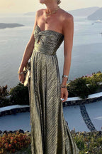 Women wearing the Harrow Britta glam sequin maxi dress with a strapless, pleated metallic design for formal events.