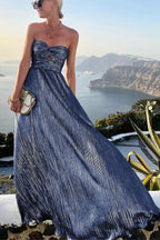 Women wearing Harrow Britta glamorous sequin maxi dress with strapless, pleated metallic design for formal events.