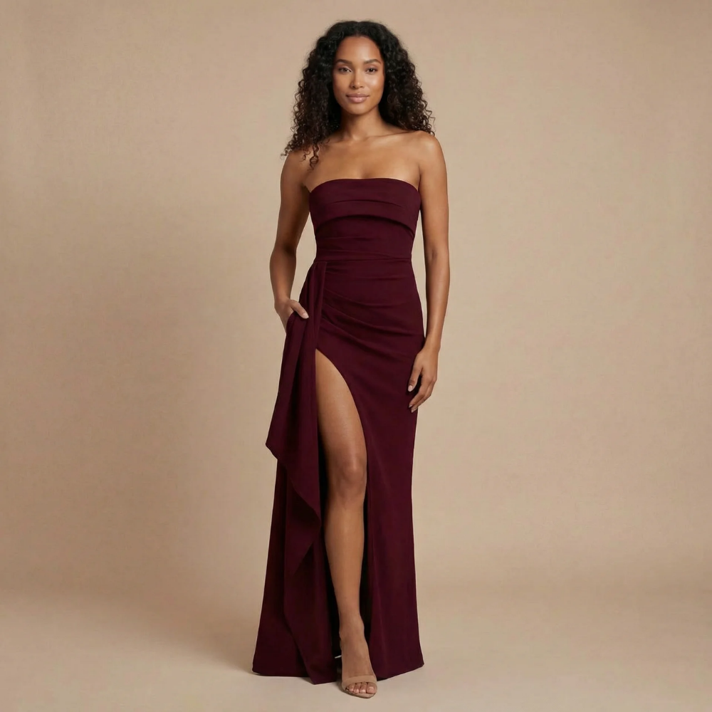 Harrow Calista sleek ruched strapless maxi dress with thigh slit, perfect for formal events, shown on a woman.