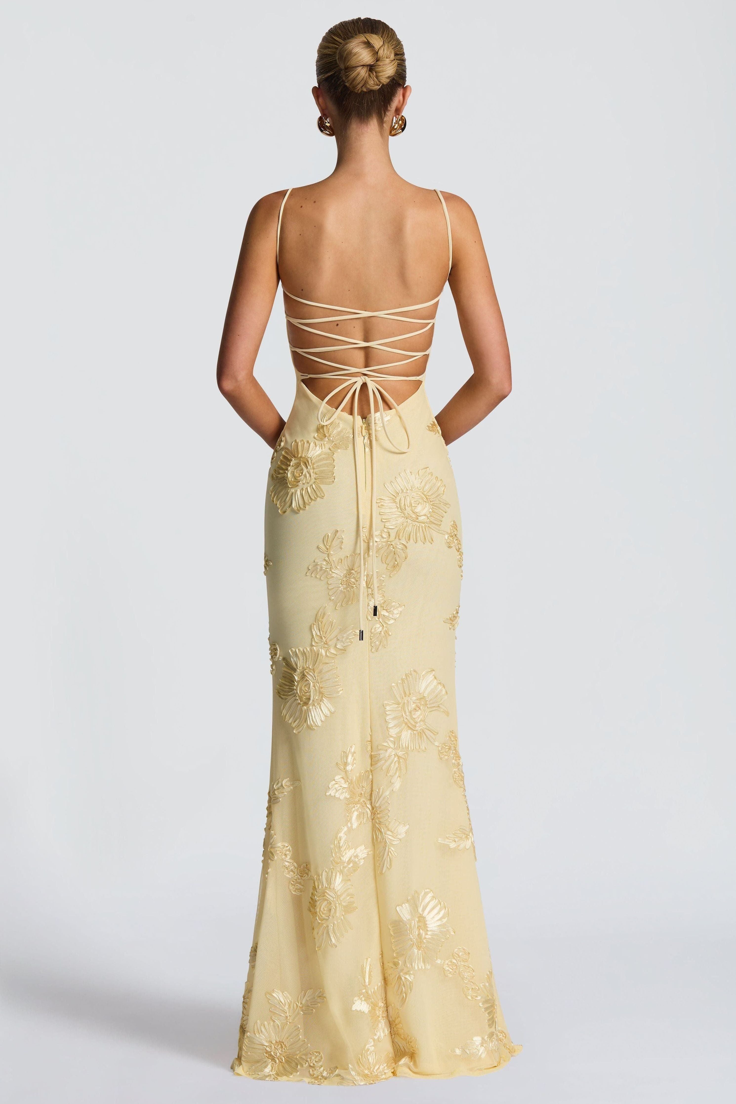 Women wearing Harrow Carina romantic floral maxi dress with sweetheart neckline and floral appliqué for prom or formal events.