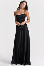 Women wearing Harrow Celeste satin maxi dress with square neckline, elegant for prom and formal events, in a stylish formal setting.