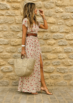 Women wearing the Harrow Celia boho maxi dress with V-neck and belt, showcasing a flowy, summery bohemian style.
