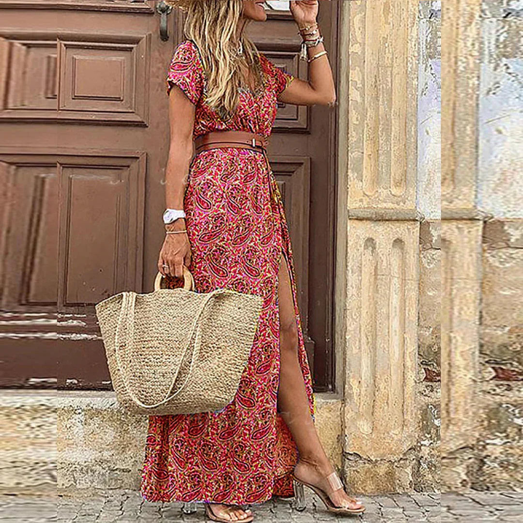 Women wearing the Celia boho maxi dress with V-neck and belt, showcasing flowing fabric and relaxed summer style.