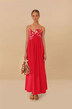 Women wearing the Chiara playful fish print maxi dress with spaghetti straps by Harrow, perfect for summer and casual occasions.
