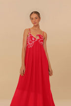 Women wearing the Chiara Harrow fish print spaghetti strap maxi dress, featuring a playful summer-inspired fish pattern.