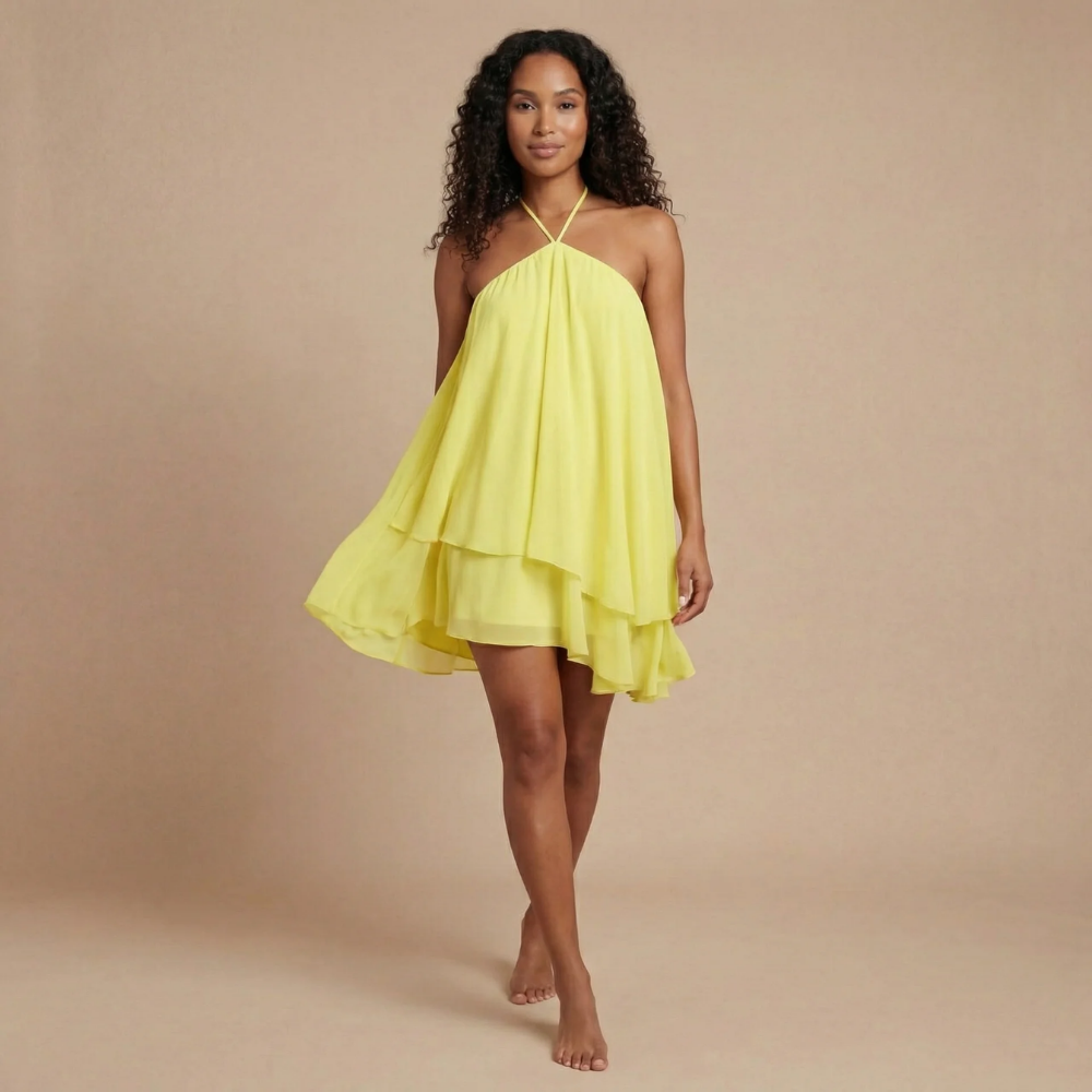 Women wearing the Cosima Effortless Halter Neck Mini Dress by Harrow, featuring a flowy summer design and halter neckline.