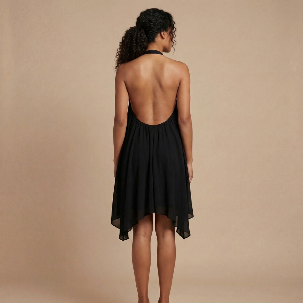 Women wearing the Cosima Harrow halter neck mini dress, featuring a flowy summer design and a stylish halter neckline.