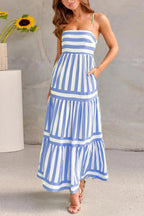Women wearing the Harrow Cybele striped maxi dress with a straight neckline and convenient pockets, perfect for summer wear.