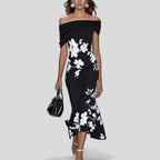 Woman wearing the Harrow Eliza floral off-shoulder midi dress, perfect for wedding guests, featuring a dreamy floral pattern.