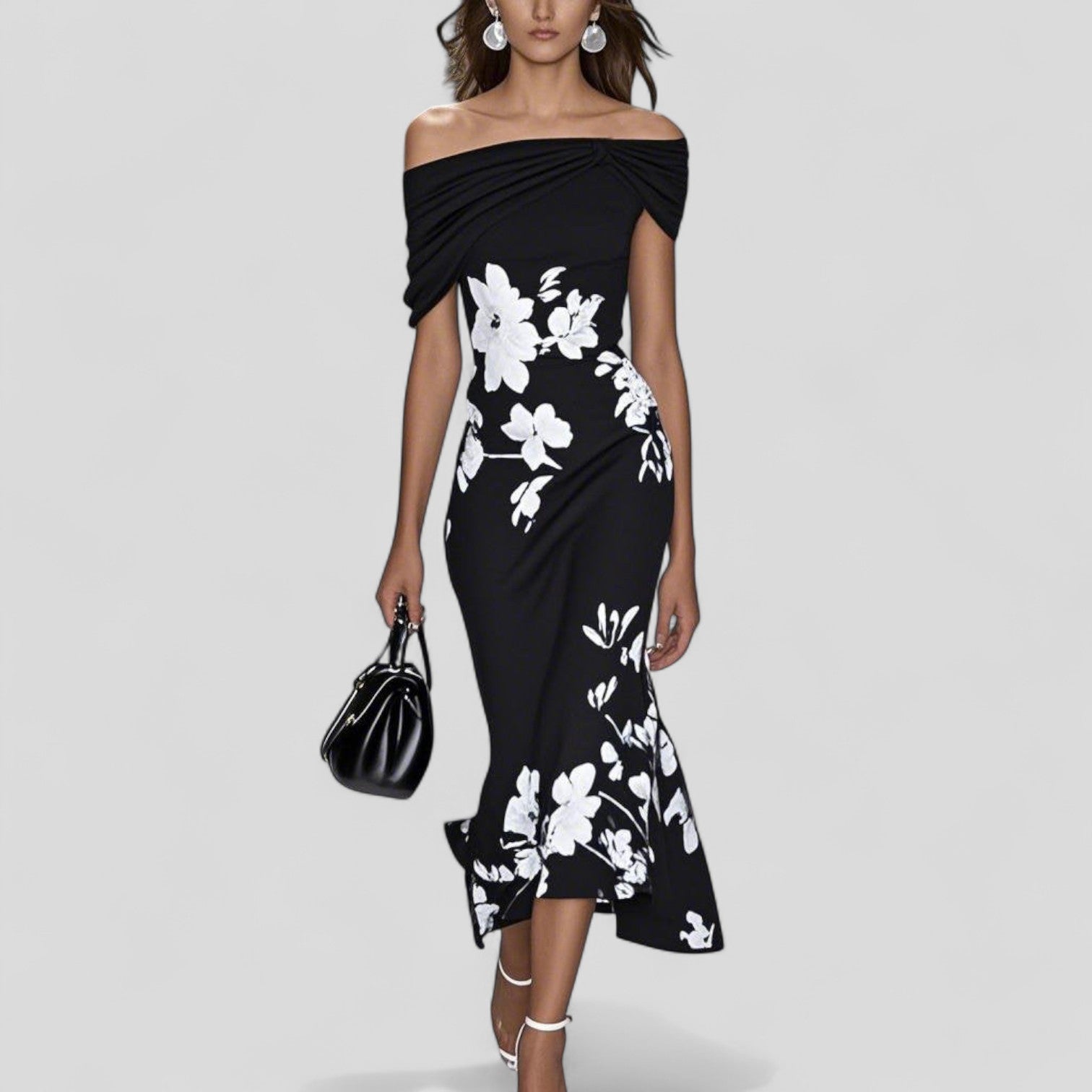 Woman wearing the Harrow Eliza floral off-shoulder midi dress, perfect for wedding guests, featuring a dreamy floral pattern.