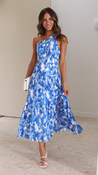 Women wearing the Harrow Elodie floral one-shoulder maxi dress, perfect for wedding guests, featuring a flowing, dreamy floral design.
