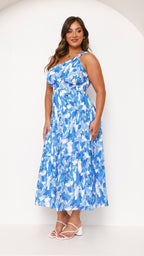 Women wearing the Harrow Elodie floral maxi dress with a one-shoulder design, perfect for wedding guests.