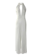 Women wearing Harrow Frances elegant halter V-neck wide-leg jumpsuit, perfect for wedding guests, in a stylish and sophisticated design.