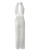 Women's elegant Harrow Frances halter V-neck wide-leg jumpsuit, perfect for wedding guests, shown in a stylish, flowing design.