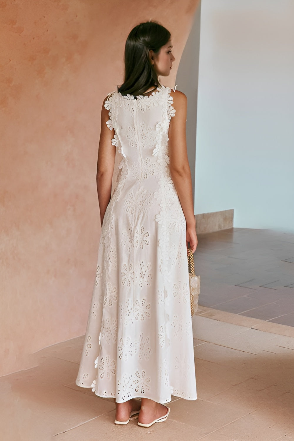 Elegant sleeveless lace-up maxi dress for women, perfect for wedding guests, by Harrow, featuring a flowing silhouette and intricate details.