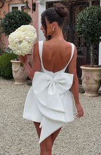 Harrow Giovanna elegant sleeveless mini dress with pearl trim, perfect for wedding guests, displayed on a model.