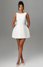 Harrow Giovanna elegant sleeveless mini dress with pearl trim, perfect for women attending weddings.