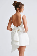 Elegant pearl trim sleeveless mini dress by Harrow, perfect for women attending weddings, featuring a stylish and sophisticated design.