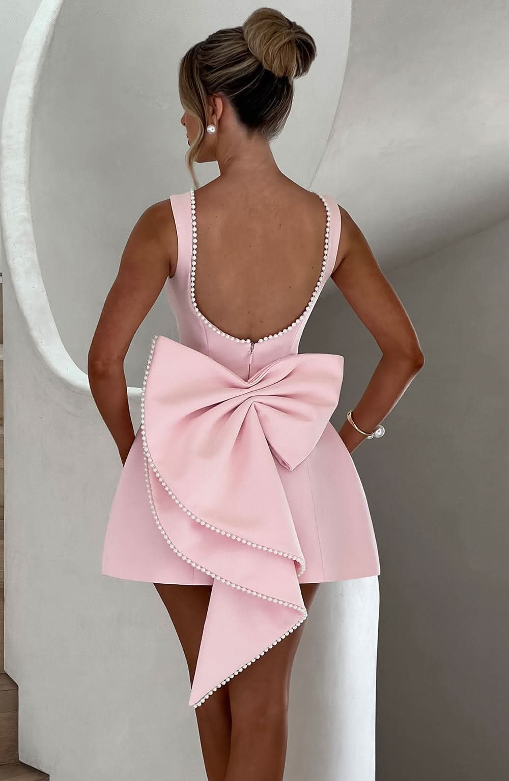 Harrow Giovanna elegant sleeveless mini dress with pearl trim, perfect for women attending weddings or special occasions.