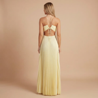 Elegant Harrow Gloria pleated halter maxi dress for women, ideal for wedding guests, featuring flowing fabric and sophisticated design.