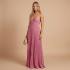 Elegant halter maxi dress by Harrow featuring pleated fabric, perfect for women attending weddings as a stylish guest.