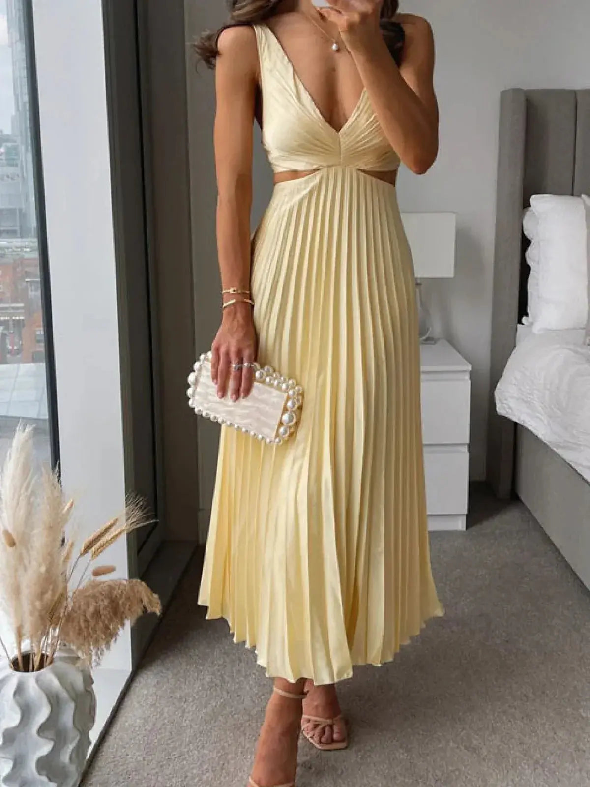 Elegant Harrow Grace pleated midi dress for women, featuring a V-neck and cutout design, perfect for wedding guest attire.